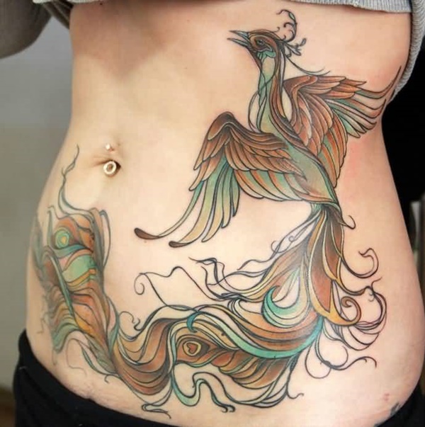Feminine touch colorful phoenix stomach tattoo.