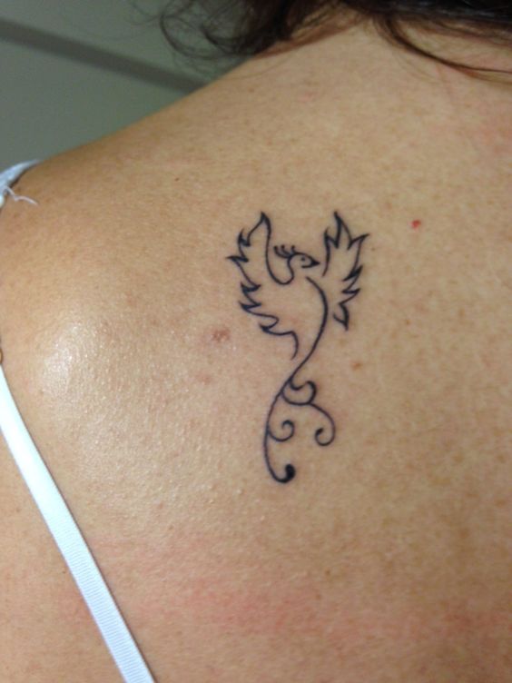 Fineline phoenix tattoo on back shoulder.