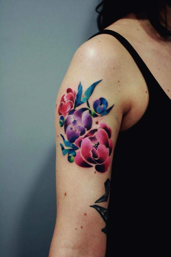 Flower arm tattoos for women.