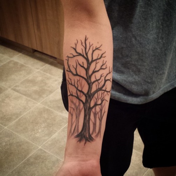 Forest theme tree tattoo on forearm.