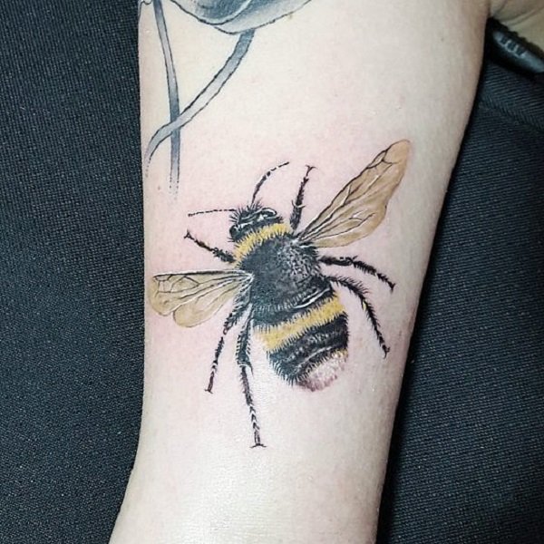 Furry bee tattoo.