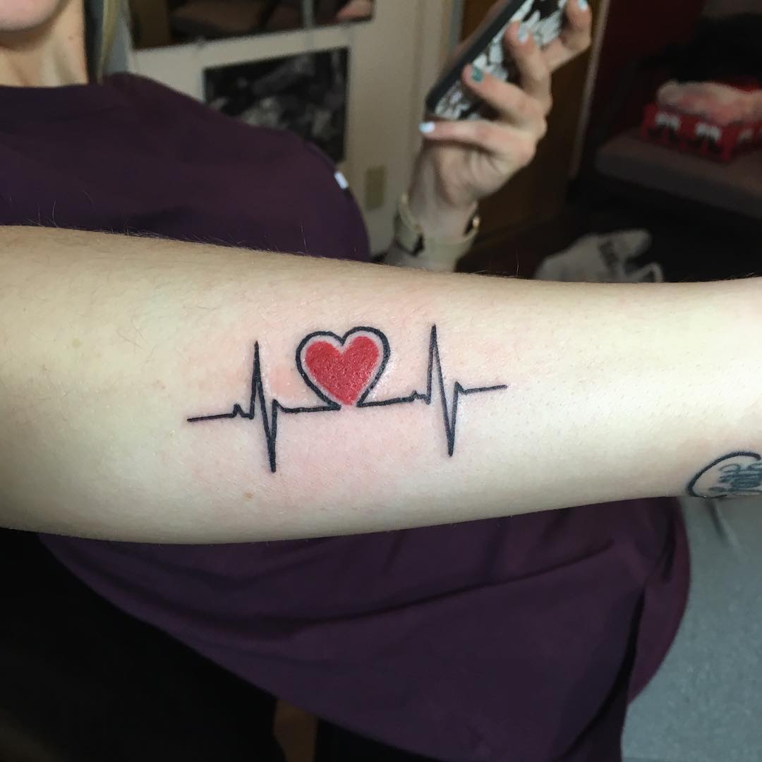 Glamorous Heartbeat Arm Tattoo.