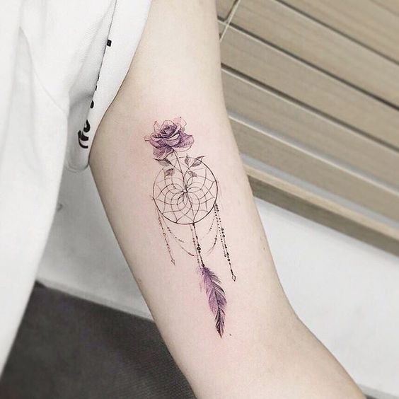 Glamorous fineline dreamcatcher tattoo with rose.