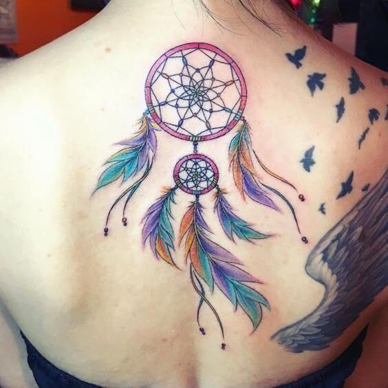Graceful dreamcatcher tattoo on back.