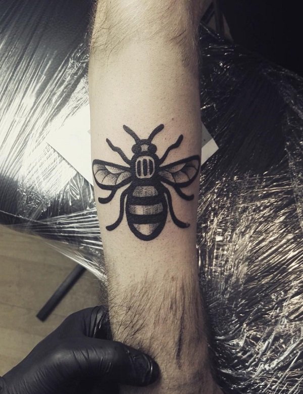Grey-scaled bee tattoo.