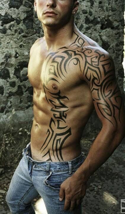 Half sleeve tattoo, continues over the man chest.