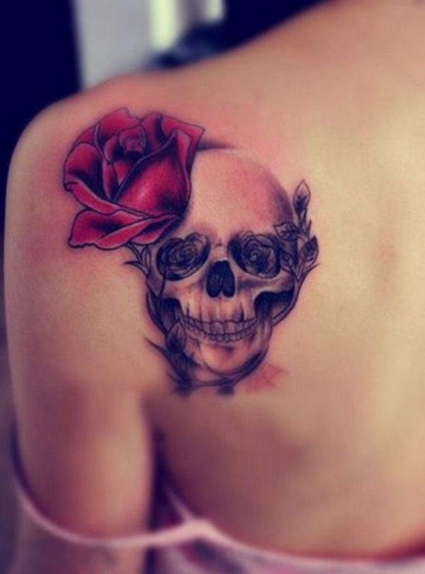 Horrible and scaring smile this skull is giving but still looking lovely with red rose.