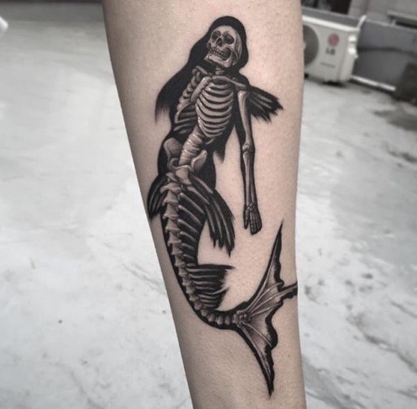 Human and fish skeletons merging.