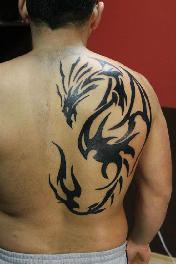 Impressive back dragon tattoo.