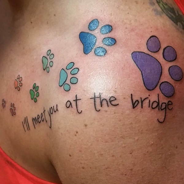 Impressive colorful dog paw print on back shoulder.