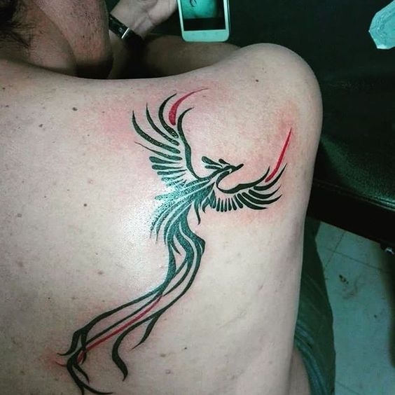 Impressive phoenix tattoo with a lovely positioning.