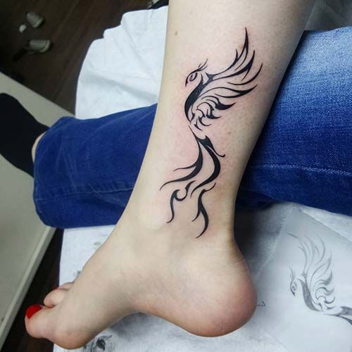 Incredible ankle phoenix tattoo design.