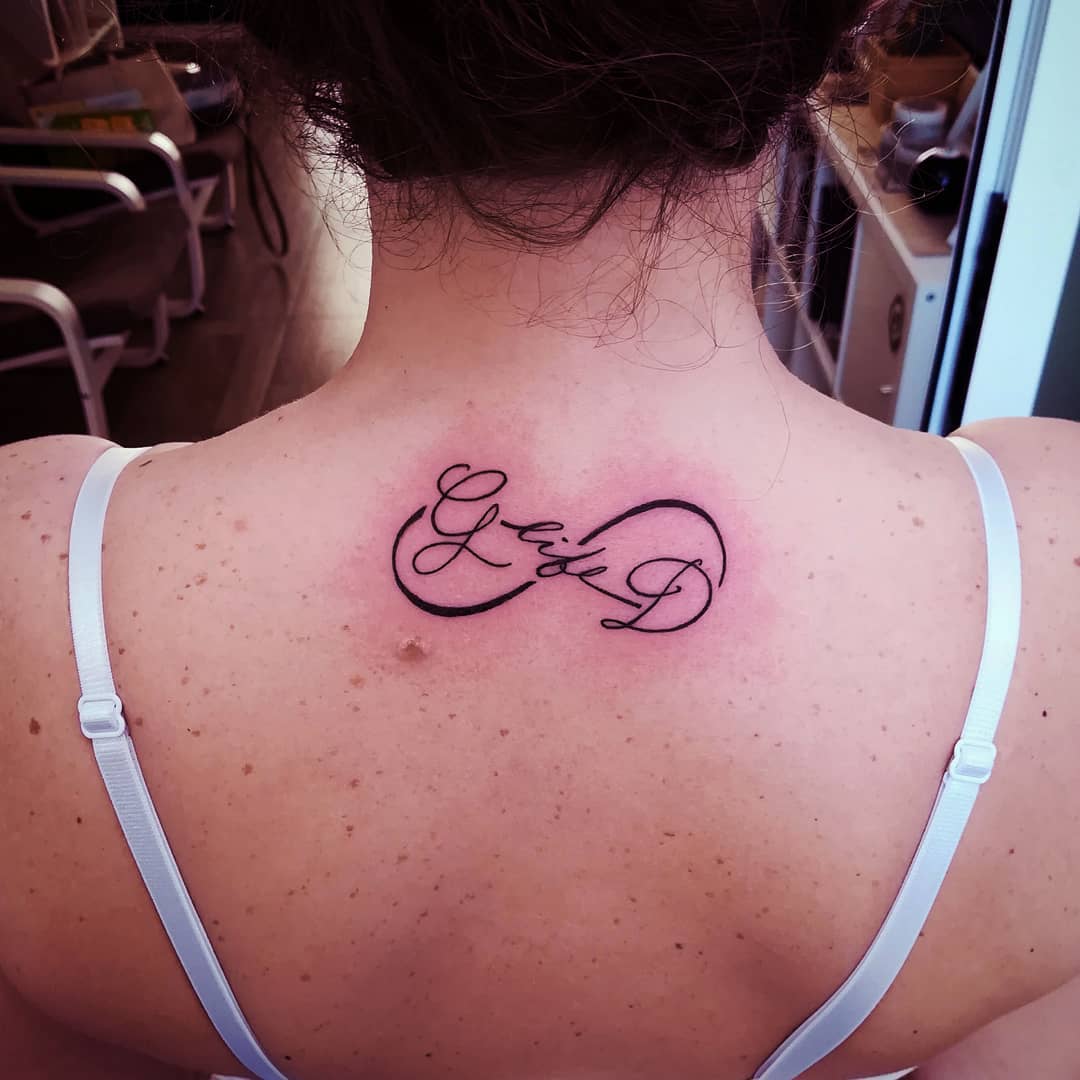 Lettering Tattoo On Back.