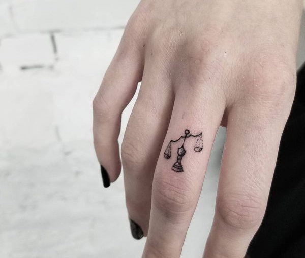 Libra tattoo is a perfect design for finger.