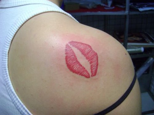 Lips Kiss Tattoo On Back Shoulder.