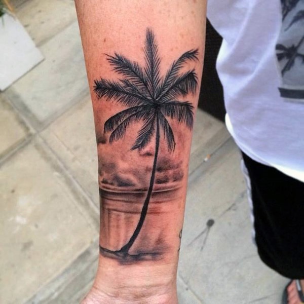 Lovely beach view tattoo with palm tree.