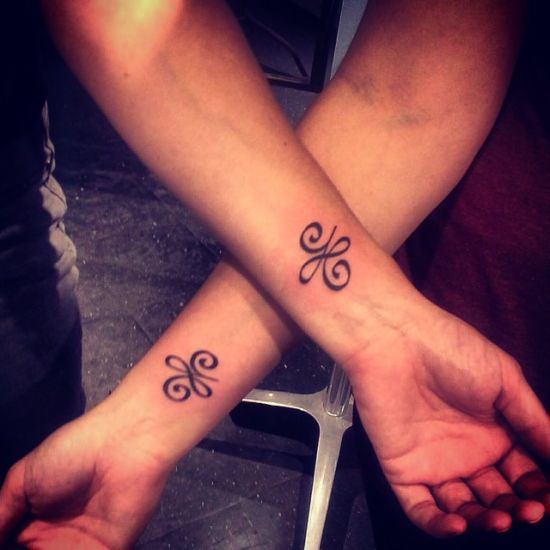 Lovely example of celtic couple tattoo.