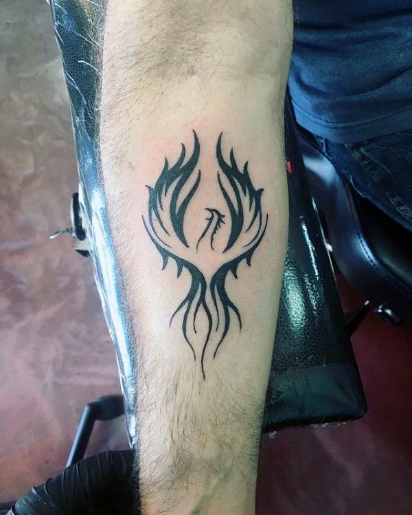 Marvelous artistic phoenix tattoo for forearm.