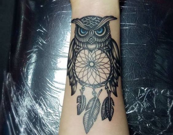 Meaningful dreamcatcher owl tattoo.