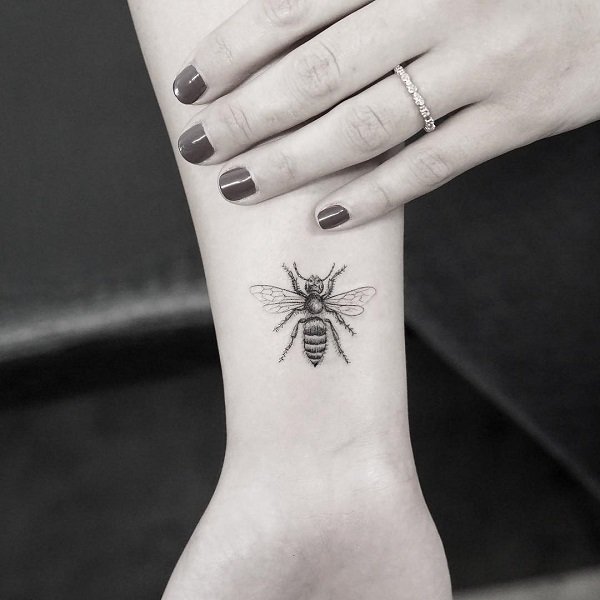 Micro honey bee tattoo.