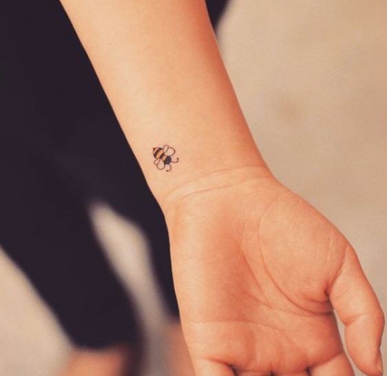 Miniature wrist tattoo.