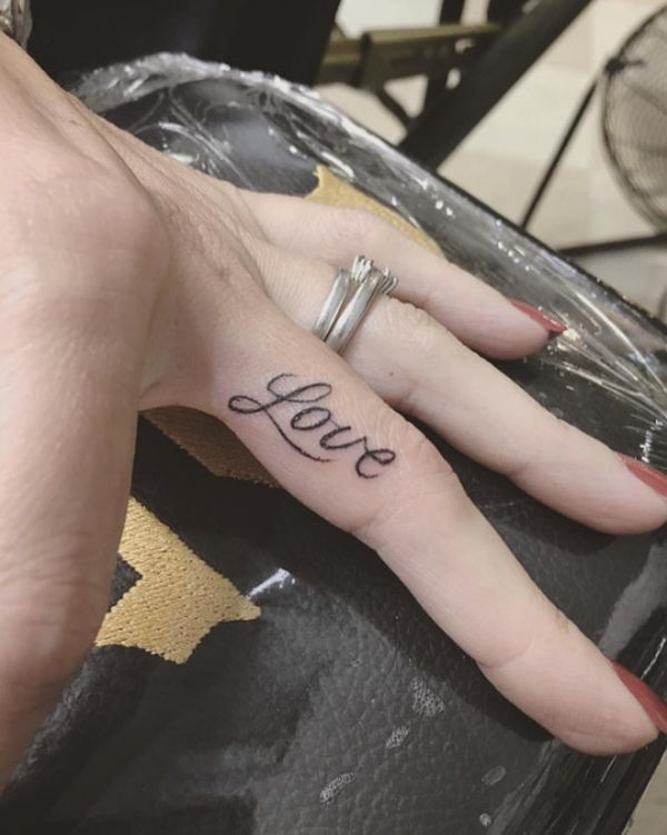 Most popular love finger tattoo in italics.