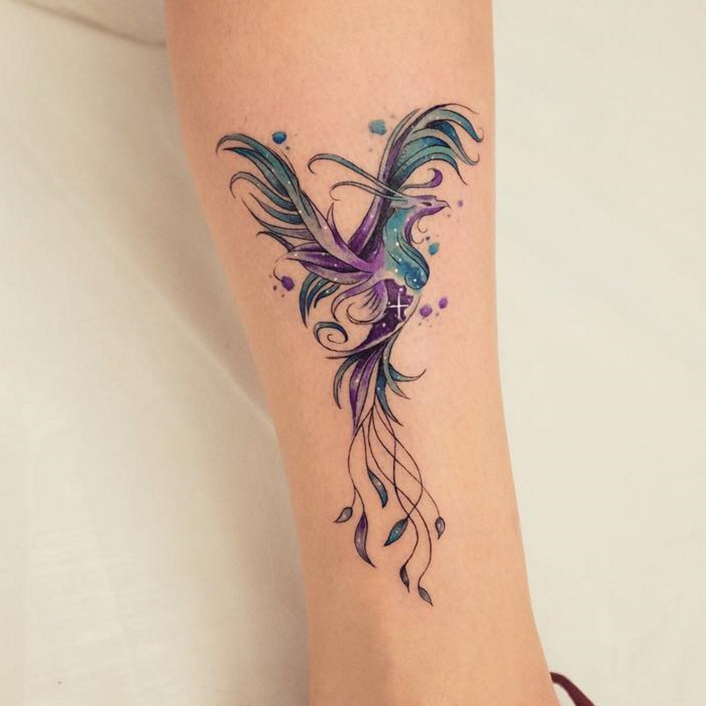 Multicolor phoenix tattoo on forearm.
