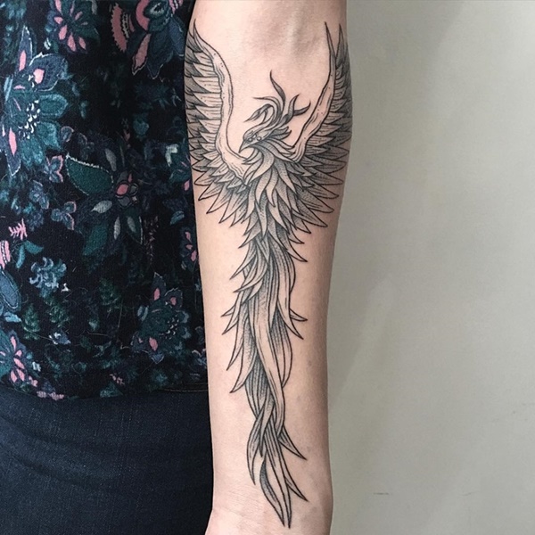 Phoenix bird on the forearm.