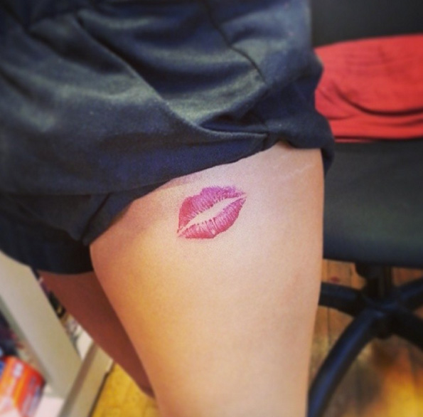 Pink Lipstick Tattoo On Thigh.