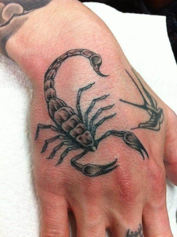 Poisonous scorpion could be your best ever hand tattoo design.