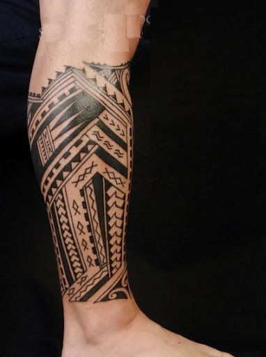Polynesian tattoos tribal designs on leg.