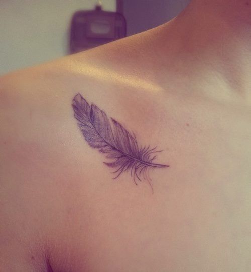 Purple feather tattoo on front shoulder.