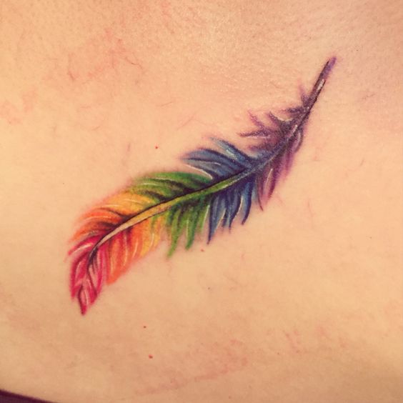 Rainbow feather tattoo idea.