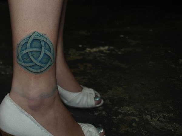 Realistic celtic tattoo with charming cracks.