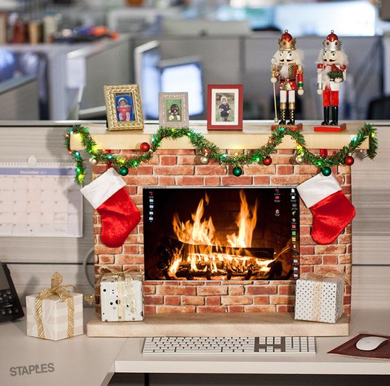 Rocking cubicle festive decor as fireplace.