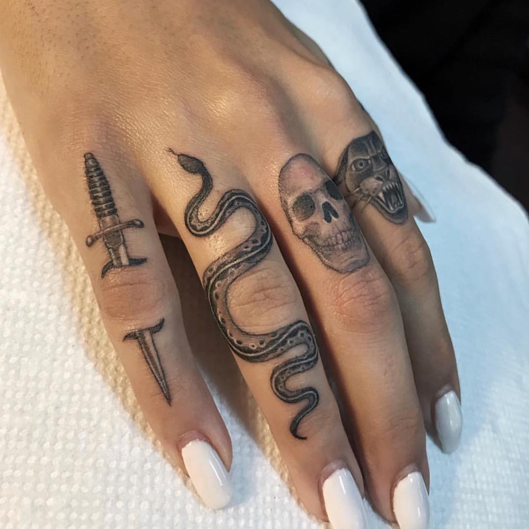 Sick finger tattoos.