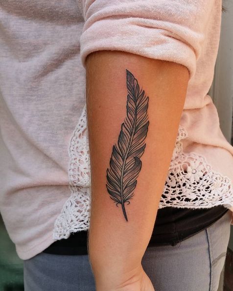 Silver black & grey feather tattoo.