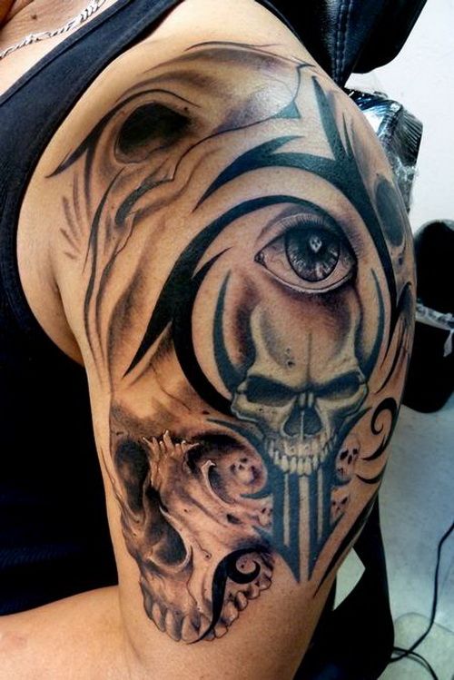 Skull tribal tattoos designs on arm.