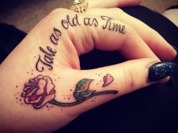 Small rose and a quote can be perfect hand tattoo for girls and boys.