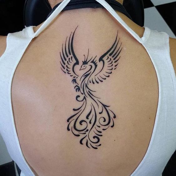 Small sized tribal tattoo on back neck.