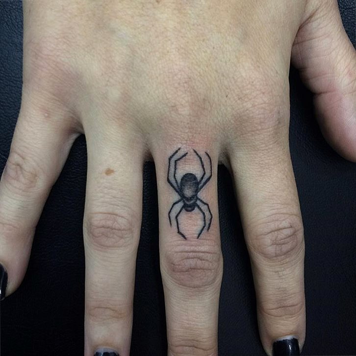 Spider on finger.