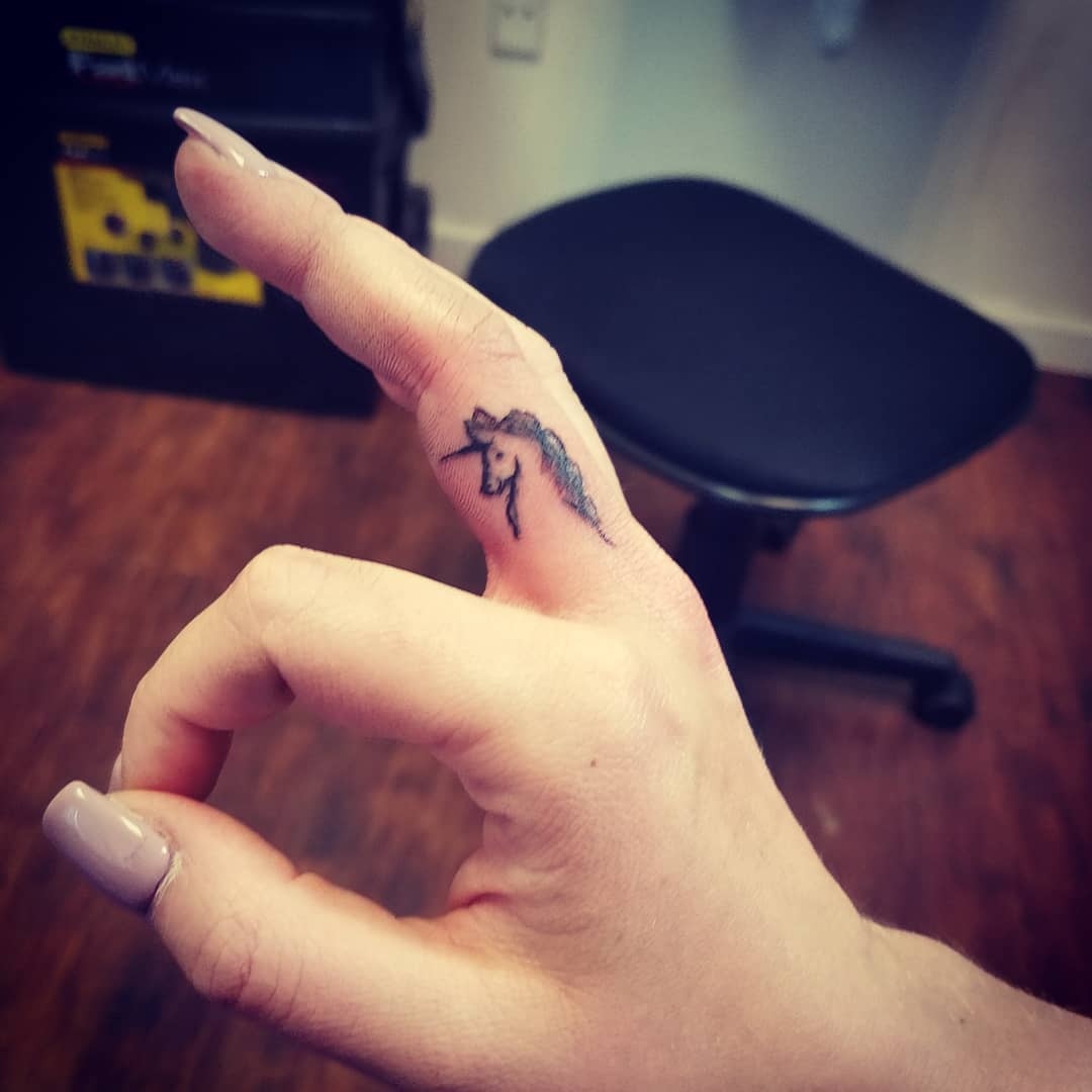 Tiny finger tattoos for girls who love ink.