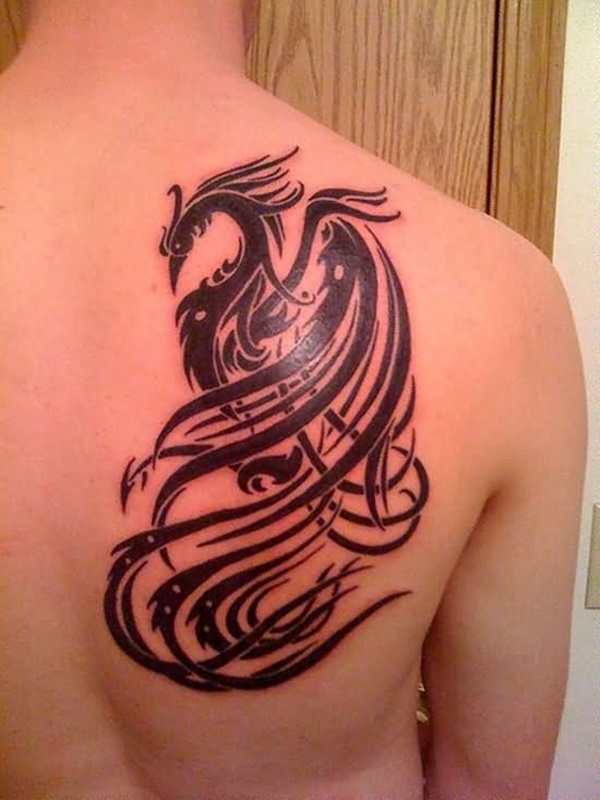 Tribal themed phoenix tattoo on back.