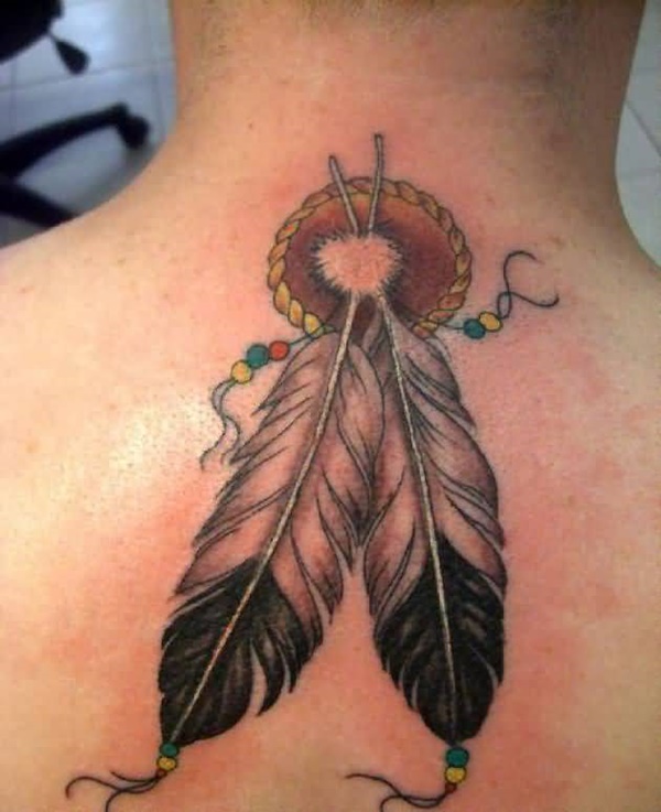 Unique feather tattoo looks like dreamcatcher.