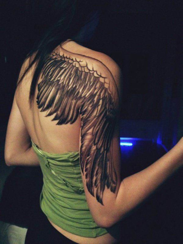 Very well-positioned angel wing tattoo.
