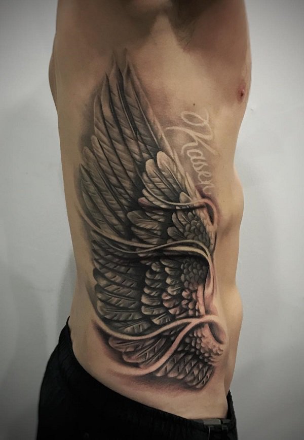 Wing side tattoo.