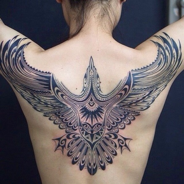 Woah A hunter eagle tattoo for brave women on her back.