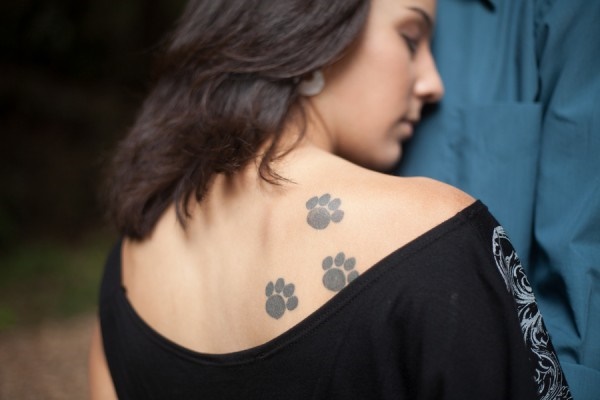 Yes you know dog paw tattoo look awesome on back.