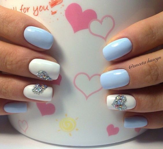 Aqua blue and white nails with swarvoski crystal heart. Valentine’s Day Nail Art