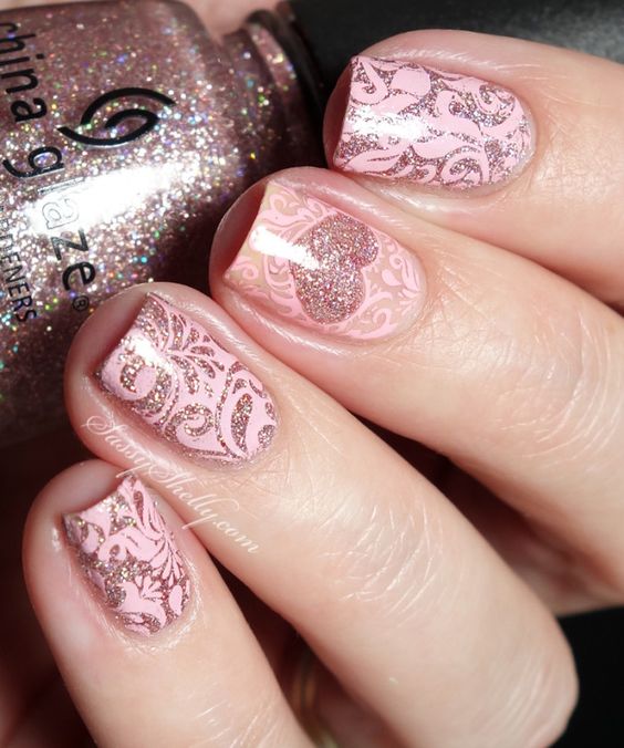 Beautiful glitter hearts and pink lace nails.